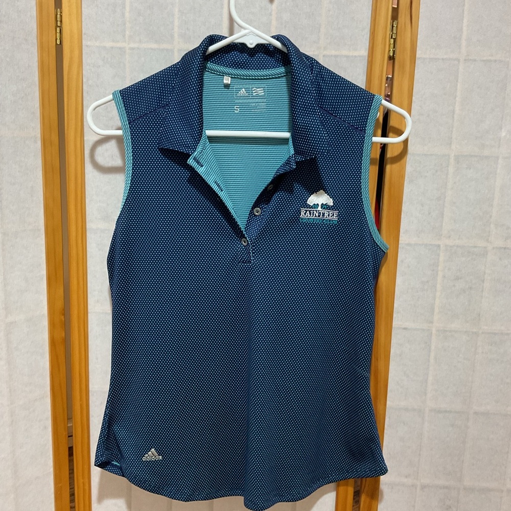 Adidas Women's Blue Sleeveless golf top.